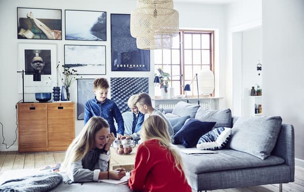 Five children playing in a living room.