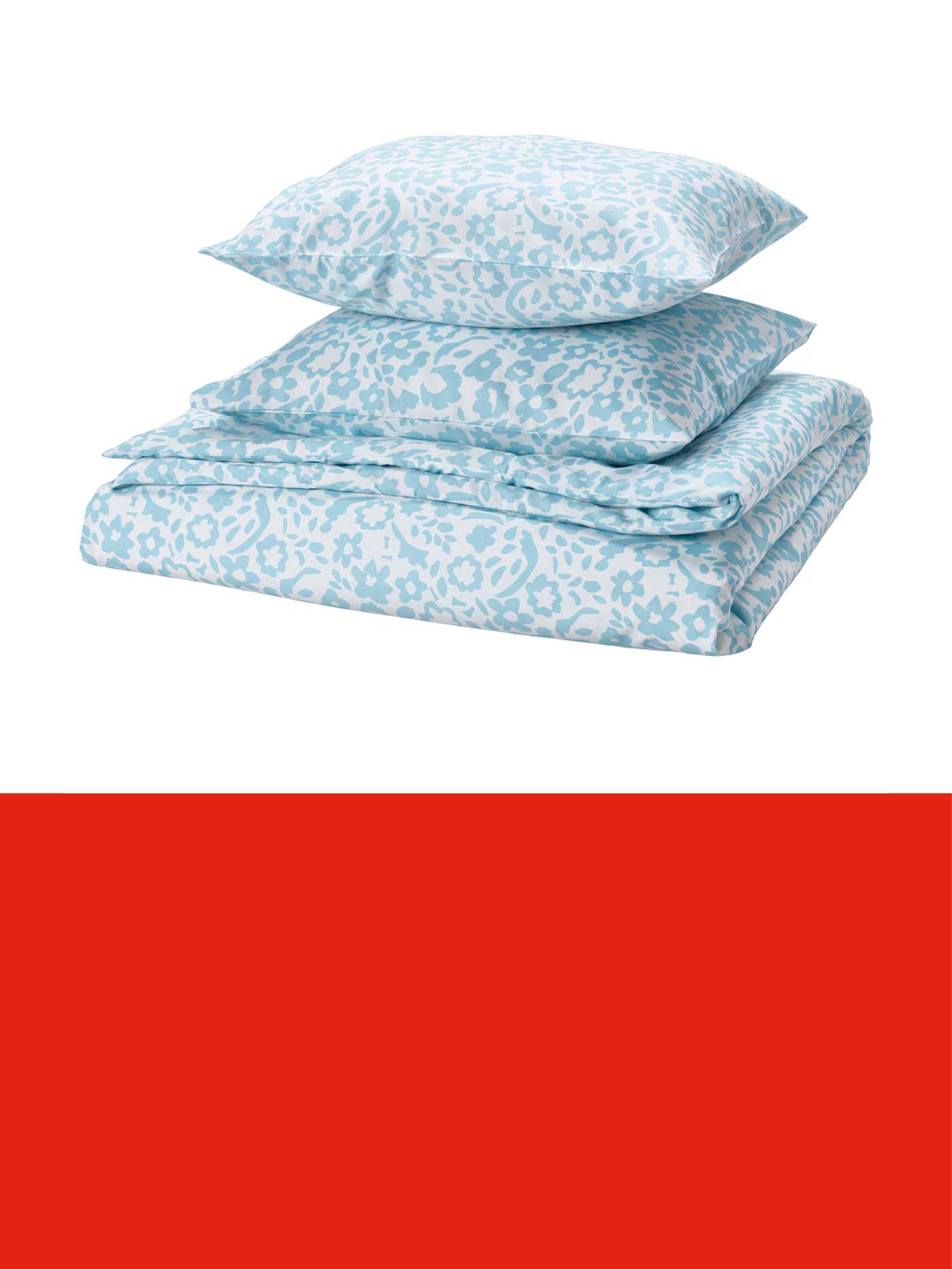 Folded light blue bedding set with a matching pillow, featuring a delicate patterned design, displayed against a light background above a red promotional banner.