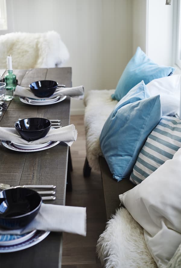 For Gina, it all started with the pastel blue cushion cover on the dining table bench.