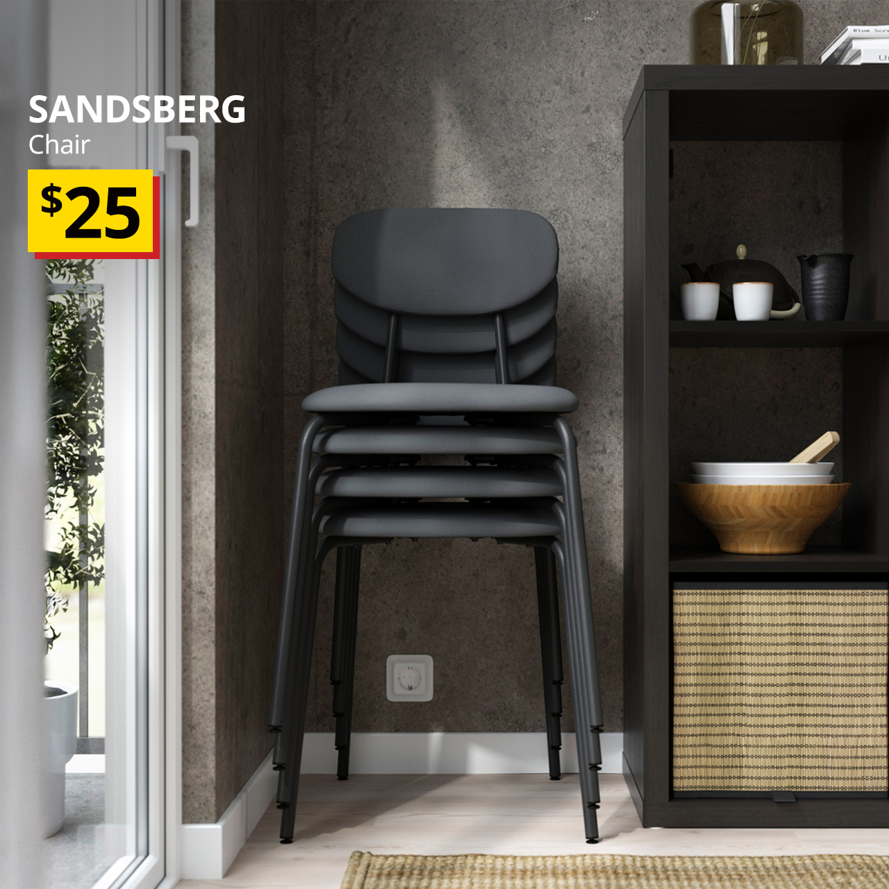 Four anthracite/remmarn anthracite SANDSBERG chair is stacked together next to a black-brown KALLAX shelving unit. An orange "New" label is on the top left of the image, with black text below that reads: SANDSBERG, Chair, with BTI price of $25"