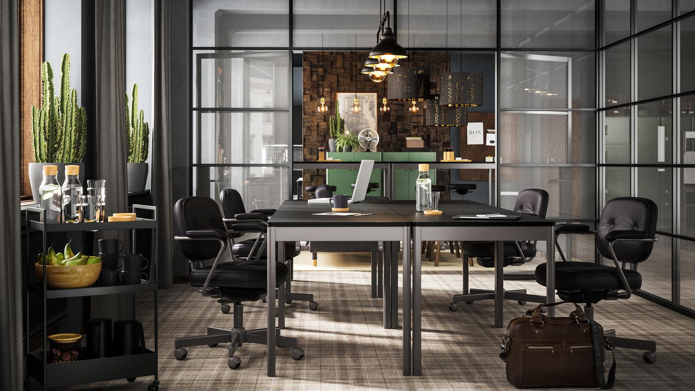 Four black/dark grey IDÅSEN tables with black chairs shown in a conference room with glass walls.