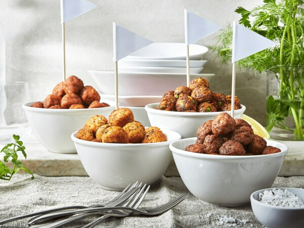 Four bowls with different types of meatball