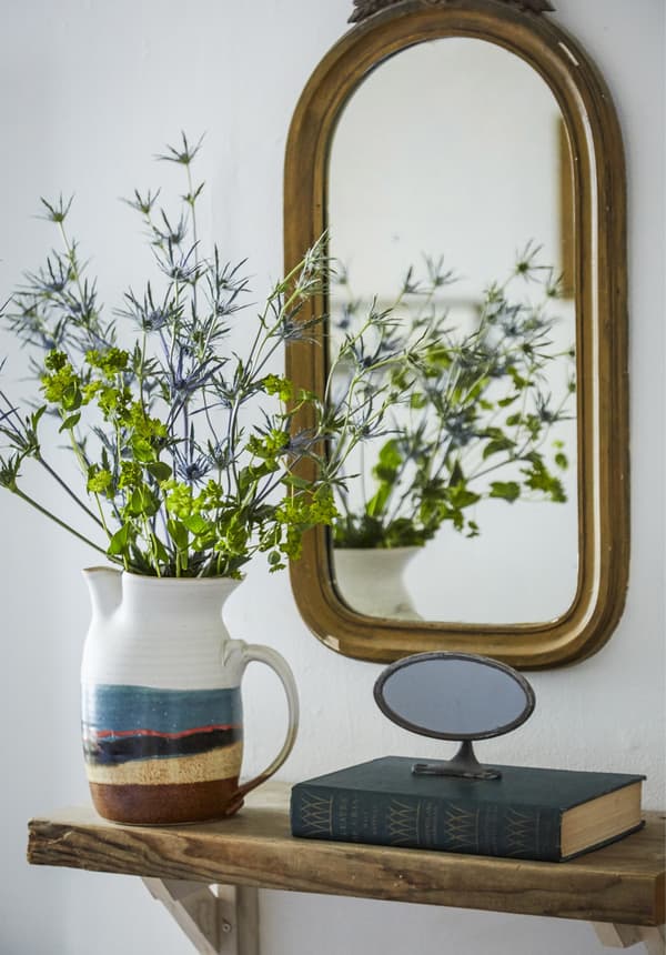 Fresh flowers displayed in a jug.