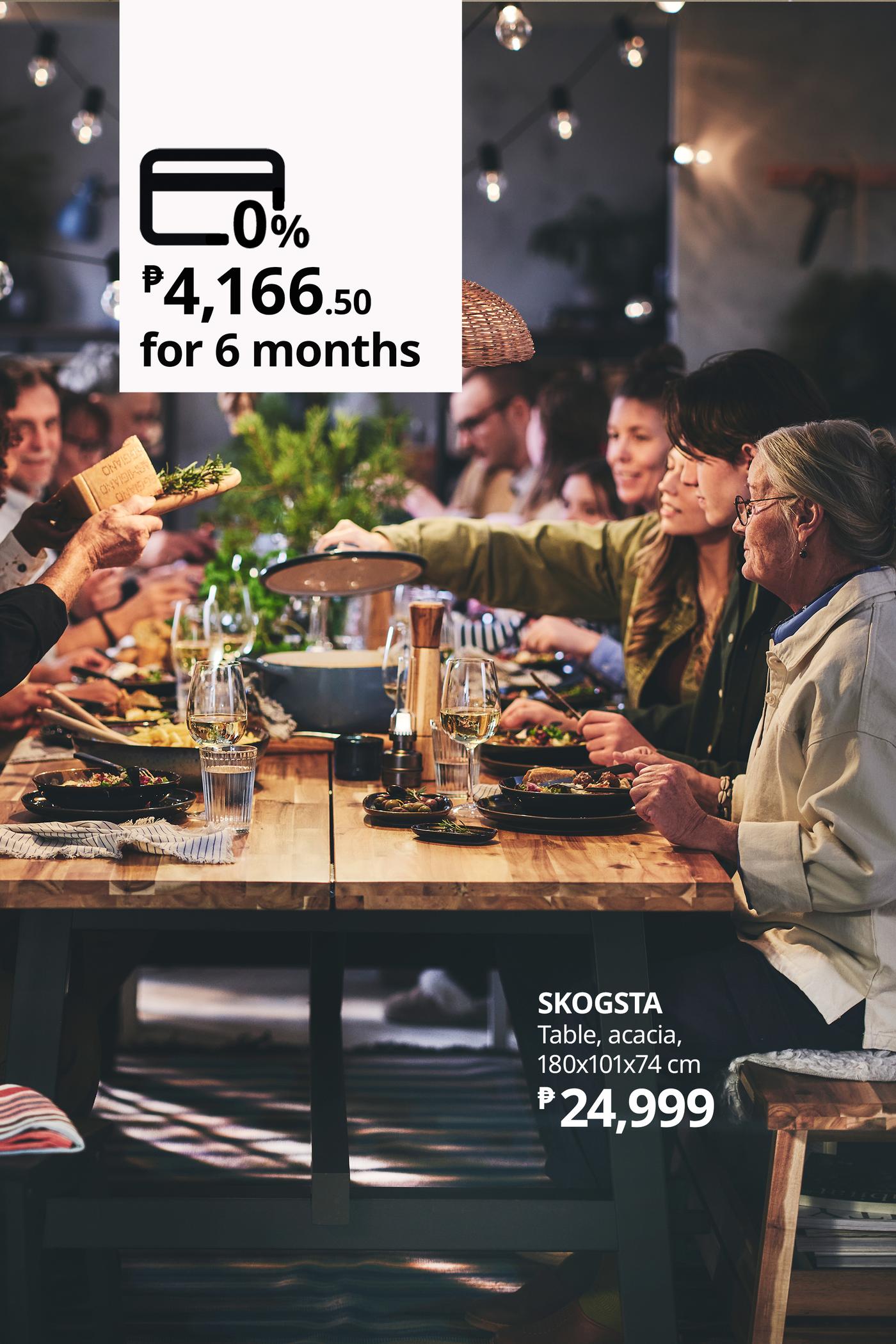 Friends share a lively dinner around a wooden table at IKEA, with food, drinks, and warm pendant lights; an overlay advertises SKOGSTA acacia table financing.