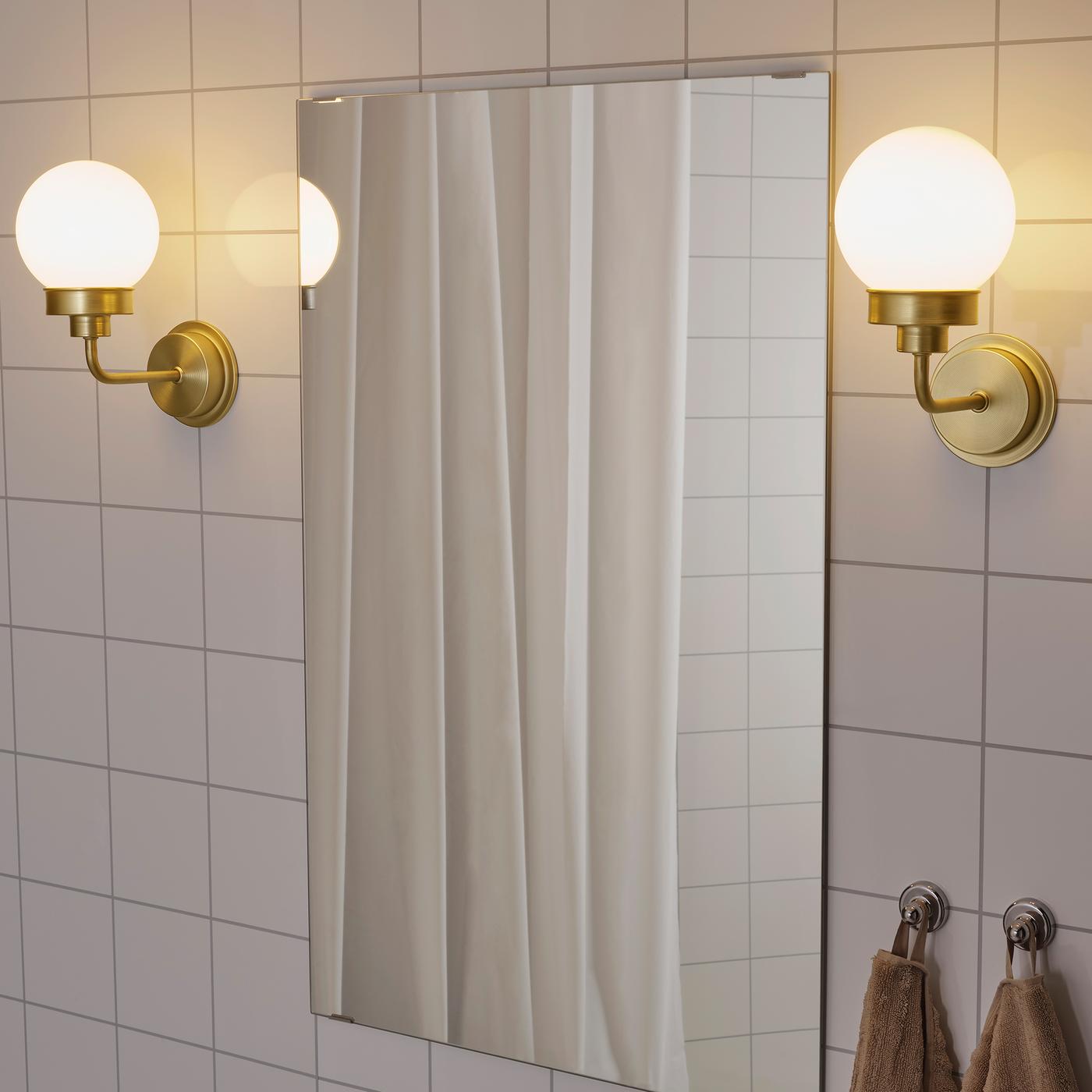 FRIHULT stainless steel wall lamp.