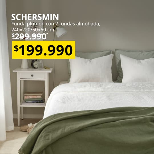 Funda plumon con dos almohadas en un dormitorio.