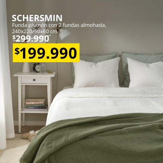 Funda plumon con dos almohadas en un dormitorio.