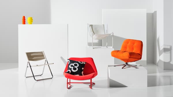 Furniture pieces showcasing soft curves, including a low chair bed with a fabric seat and smooth cermatic vases with rounded shapes, reflecting timeless elegance.