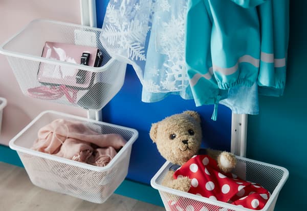 Get organised with baskets on the wall for different family members essentials.