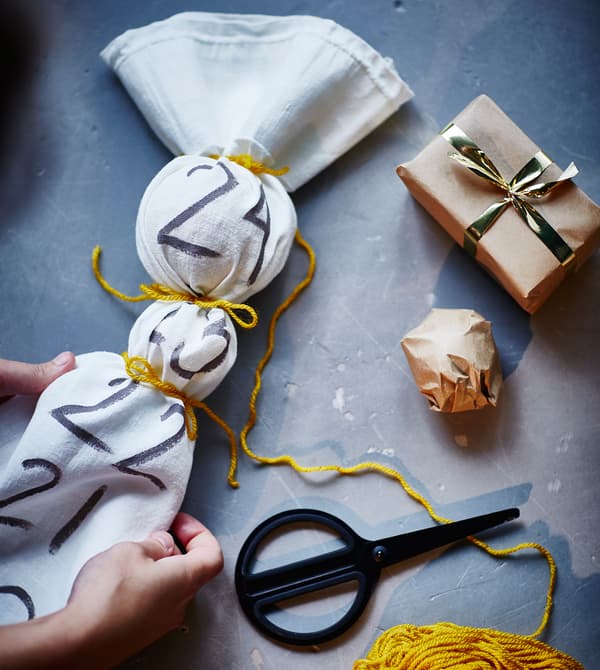 Gifts are placed inside a fabric advent calendar.