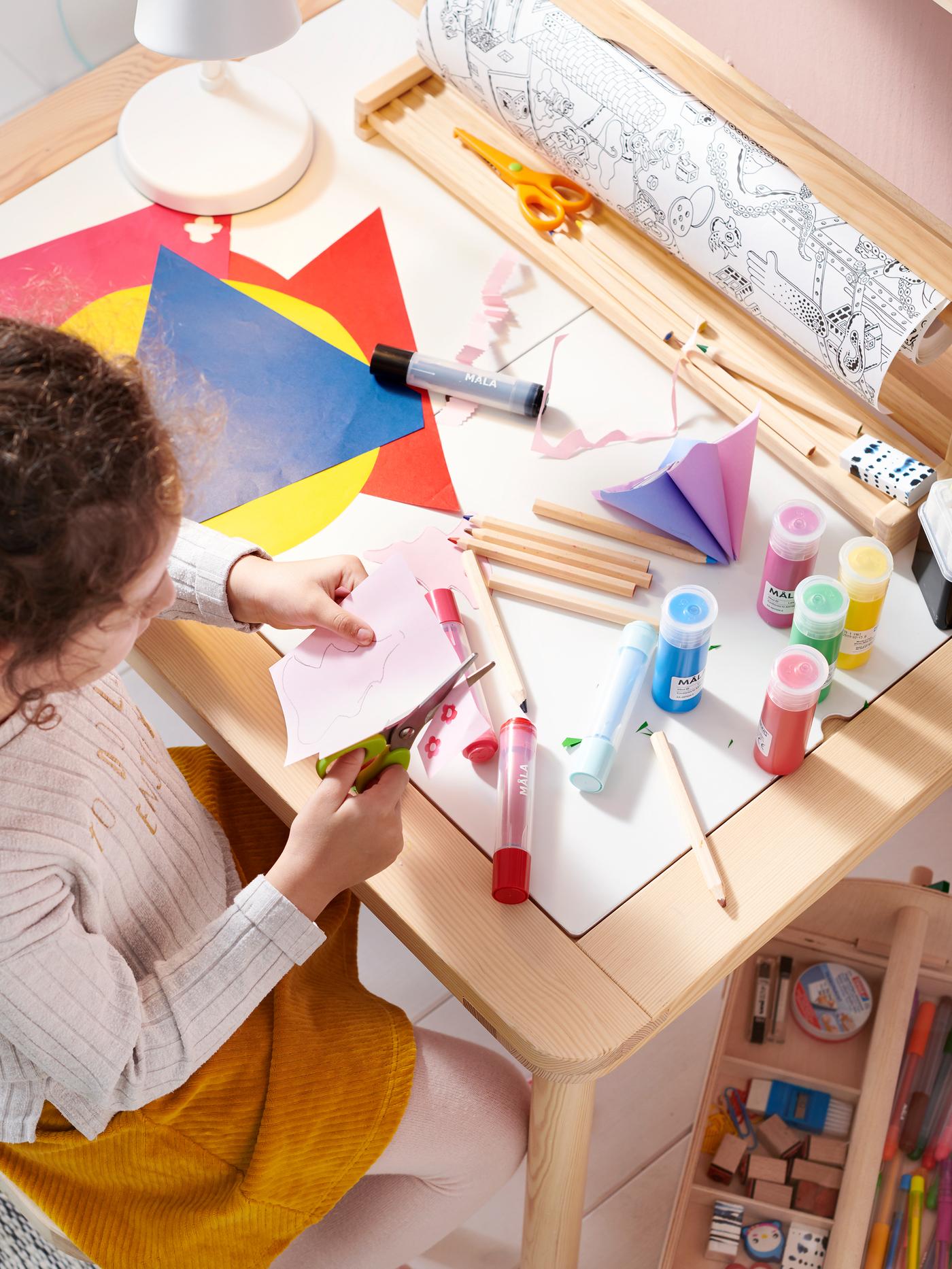 girl coloring with markers