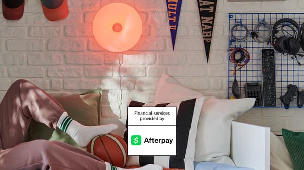 girl on sofa with Afterpay logo 