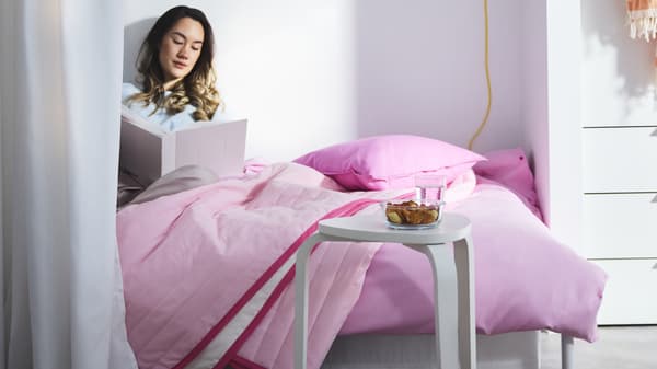 girl sitting on bed