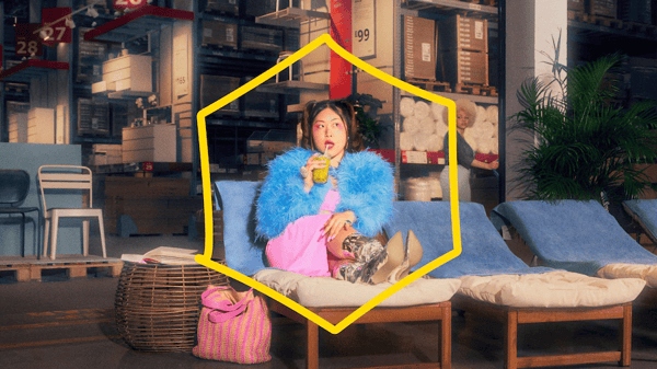 Girl sitting on couch eating candy