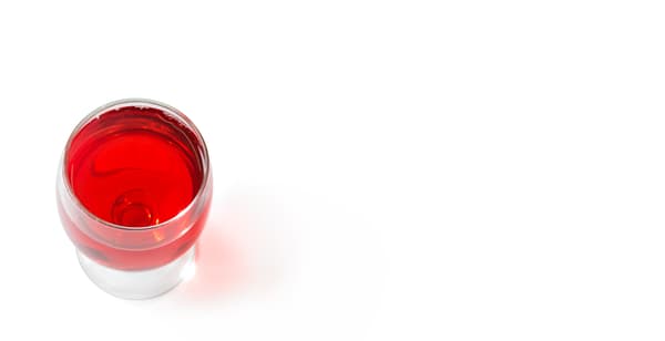 glass full of red lemonade