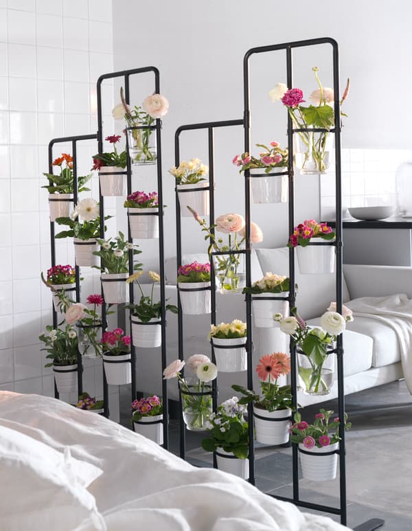 Got garden dreams but only a small apartment? Try a room divider to make a vertical flowerbed.