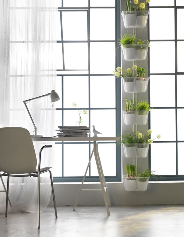 Got garden dreams but only a small apartment? Try extending your windowsill using the space inbetween windows to plant.