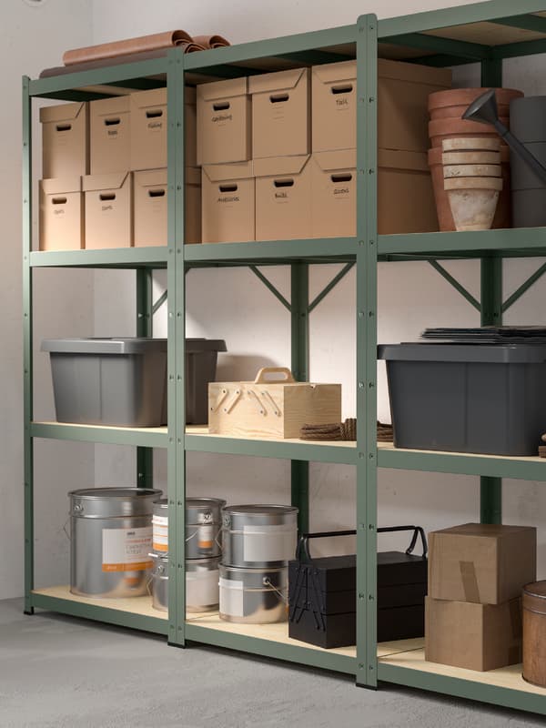 Green metal storage shelves with storage boxes