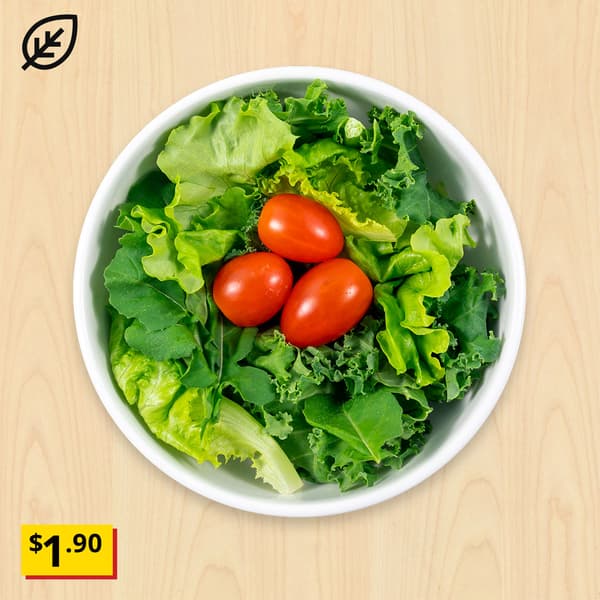 Green salad consisting of Locally-grown kale, arugula, oak leaf lettuce and cherry tomato with citrus dressing). Breathtaking item price: $1.90. Plant food symbol at top left corner.