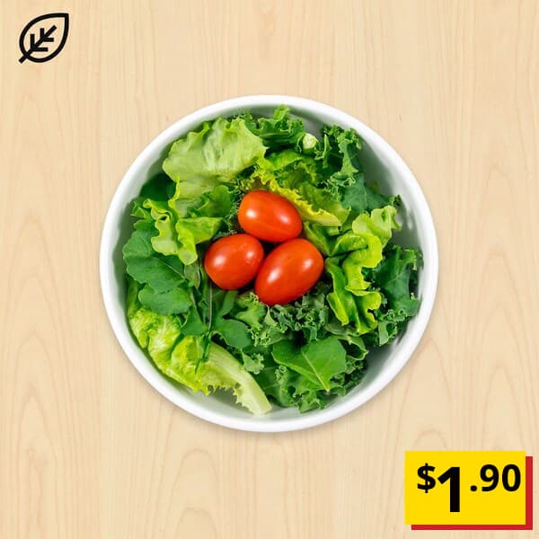 Green salad consisting of Locally-grown kale, arugula, oak leaf lettuce and cherry tomato with citrus dressing). Breathtaking item price: $1.90. Plant food symbol at top left corner, NEW tag at bottom left corner. 