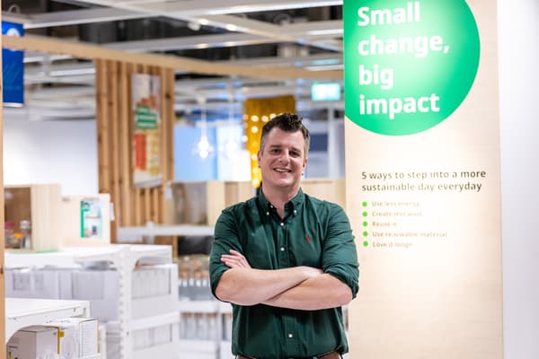 Greg Lucas wearing a green shirt in an IKEA store