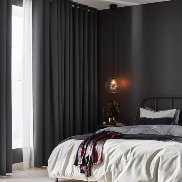 Grey bedroom with a white bed