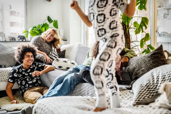 Group of people sitting in the living room and having fun