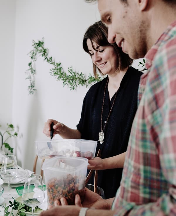 Guests bring food in plastic containers