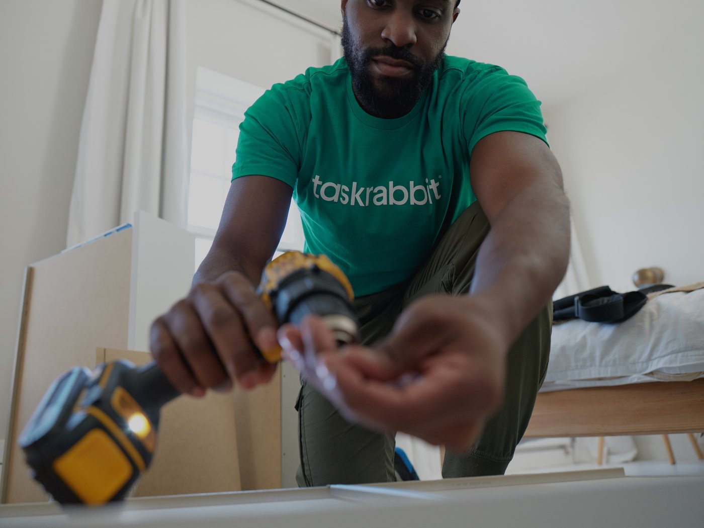 guy assembling furniture