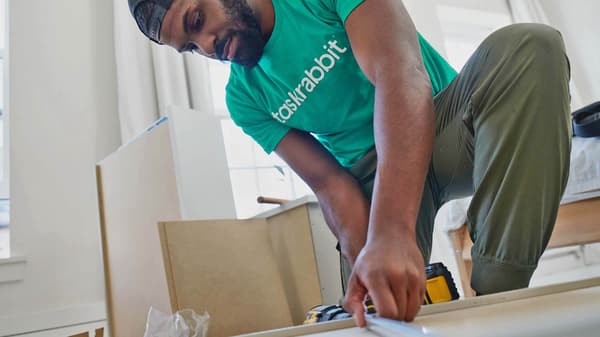 guy assembling furniture