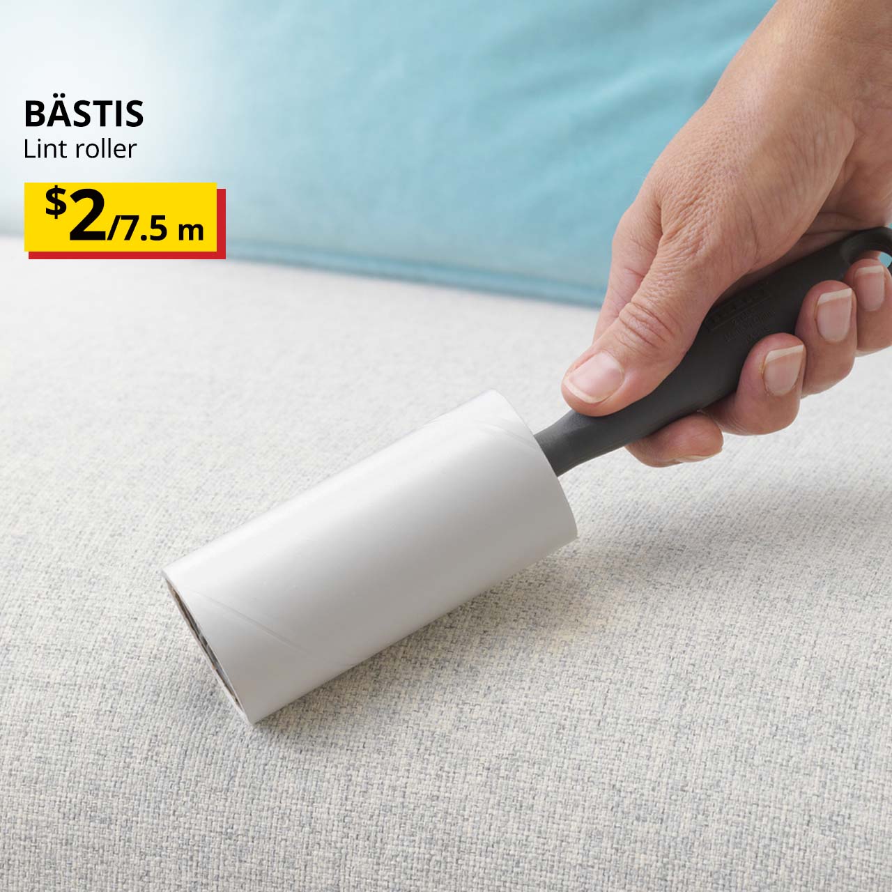 Hand holding a BASTIS lint roller over a sofa cushion cover. Price: $2/7.5m