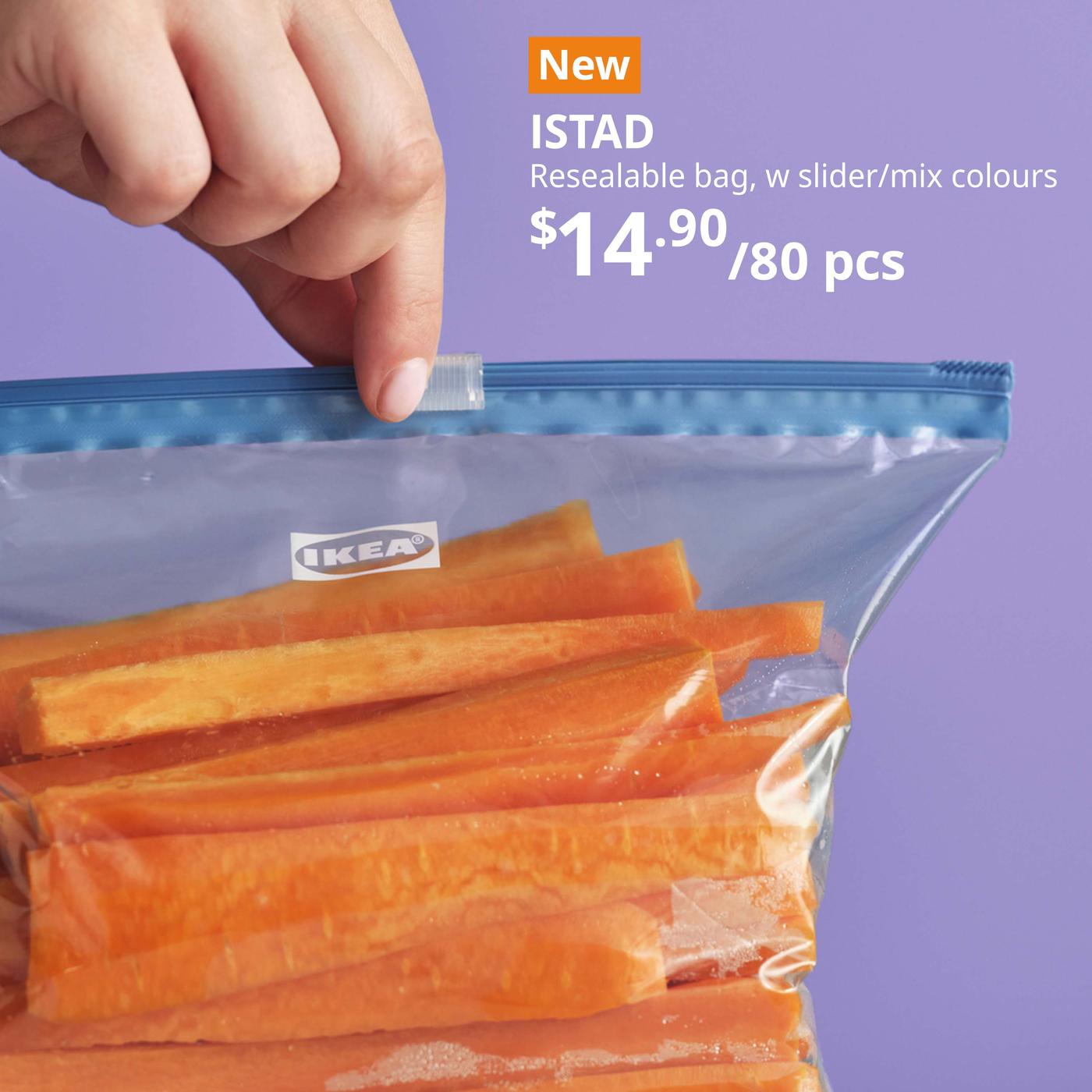 Hand holding up a blue ISTAD resealable bag, with slider/mixed colours, 1/2/4 l. Price: $14.90/80 pieces.