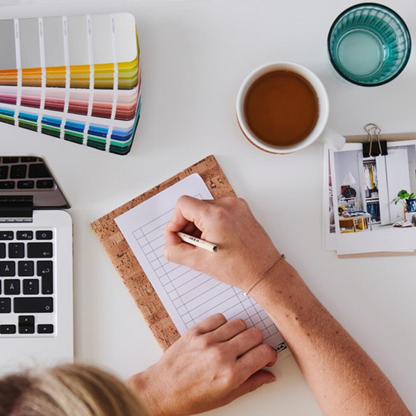 Hand writing on a paper for remote planning
