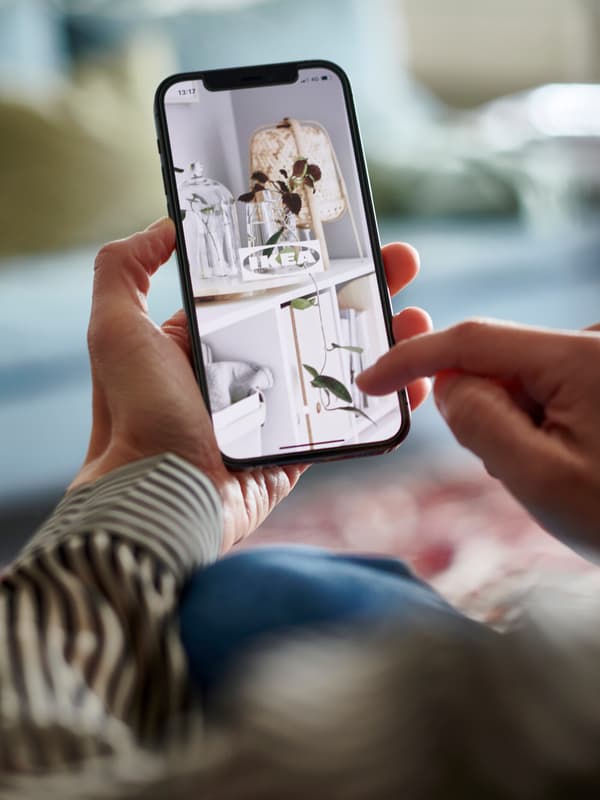 hands holding IKEA Shoppable mobile app