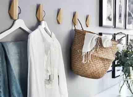 Hang clothes and accessories on SKUGGIS bamboo hooks to add extra room storage