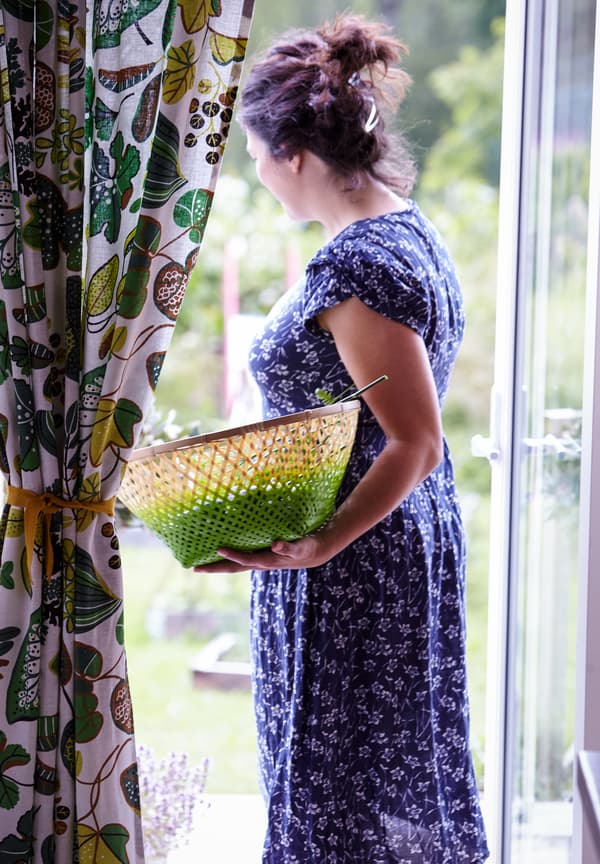 Helena picks fresh fruits and vegetables.