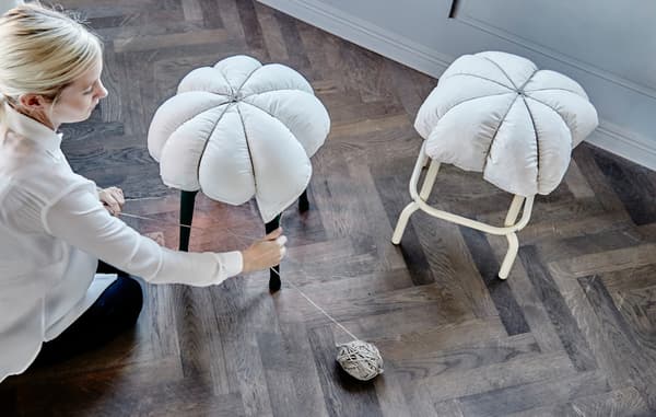 Here’s a DIY idea that takes 5 minutes to put together and makes hard seats seriously comfy. All you need is a pillow and a length of string (we like the rustic twine version). Then loop your string over the pillow and stool making 8 equal sections and tie a firm knot at the top. Finished!