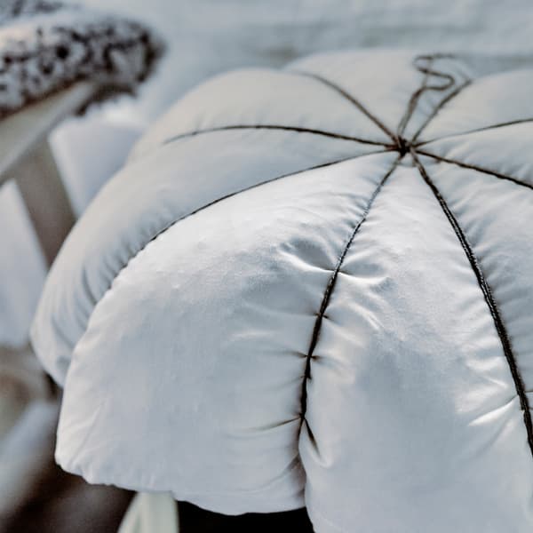 Here’s a DIY idea that takes 5 minutes to put together and makes hard seats seriously comfy. All you need is a pillow and a length of string (we like the rustic twine version). Then loop your string over the pillow and stool making 8 equal sections and tie a firm knot at the top. Finished!