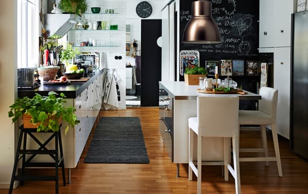 Here’s a modern white kitchen with island and open storage.