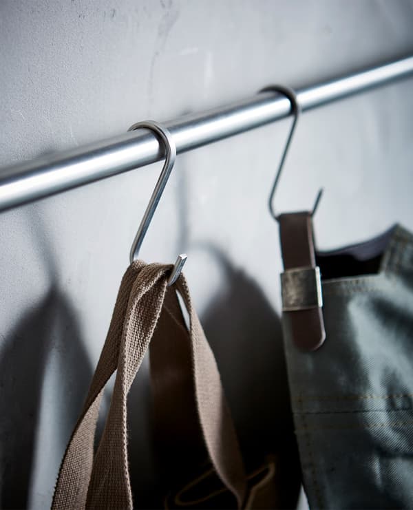 Hooks on rails hanging equipment and a cap.