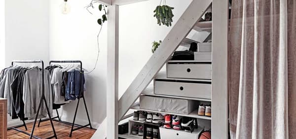 How to use an awkward space under the stairs for storage