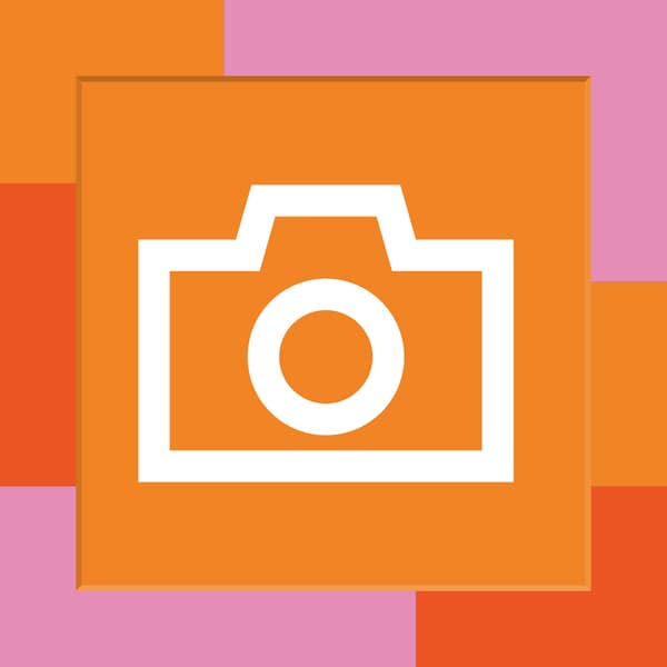 Icon eines Fotoapparates auf orangen Hintergrund.