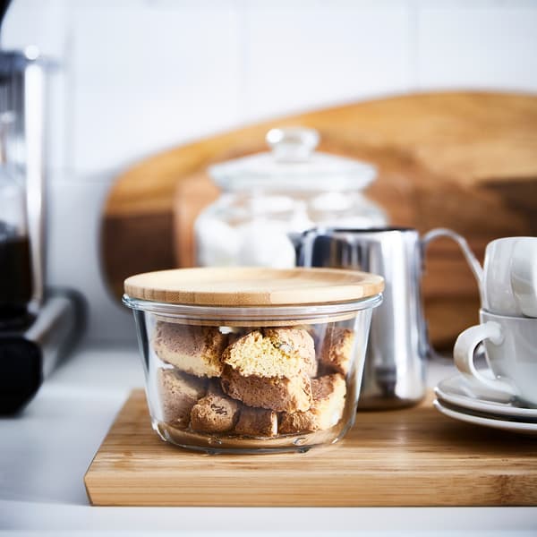 IKEA 365+ glass food container with bamboo lid, filled with rusks.