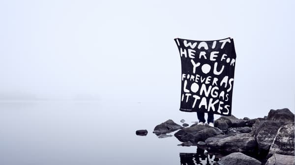 IKEA Art Event rug with words "I wait here for you forever as long as it takes"