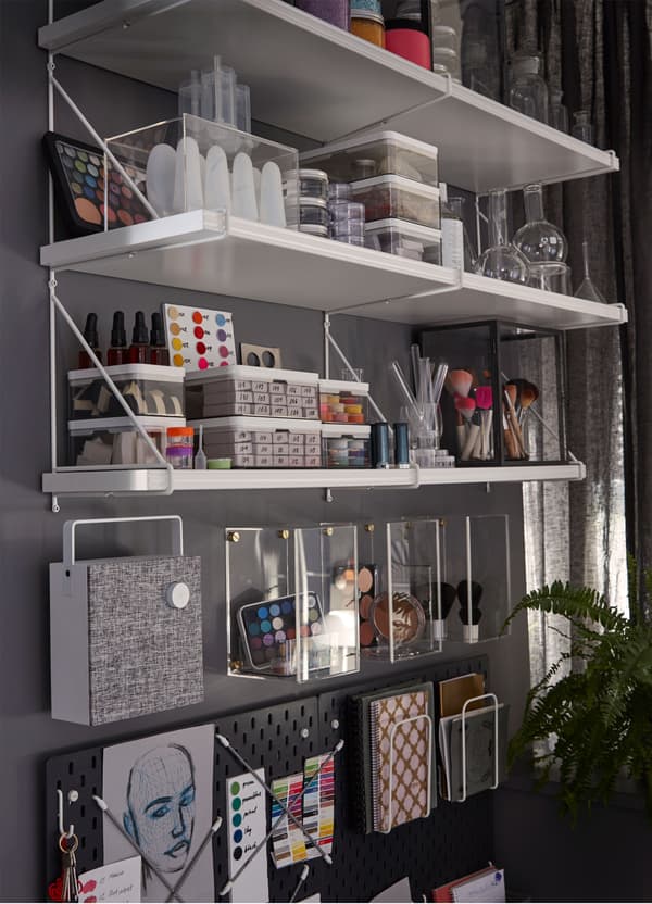 IKEA BERGSHULT white shelves, mounted with triangular PERSHULT brackets creating a customised storage shelving solution.