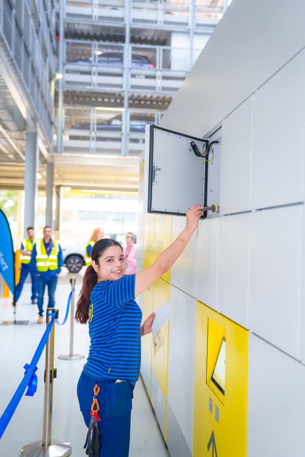 IKEA co-worker placing item in locker