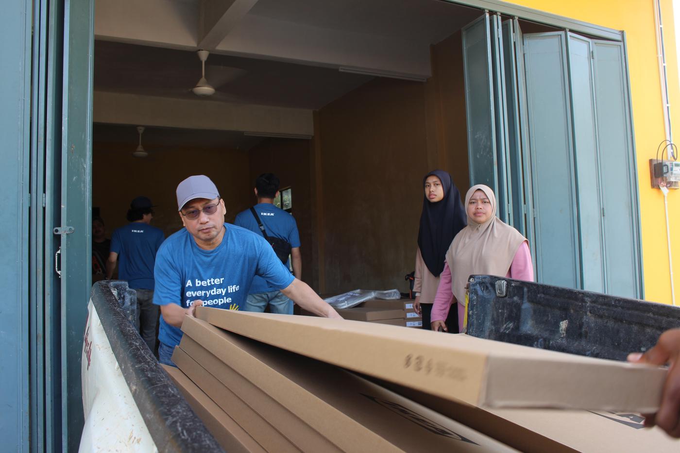 IKEA co-workers brought out the flat-packed furniture for customers