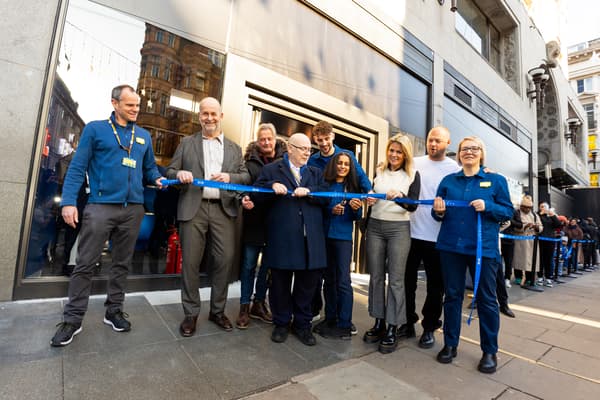 IKEA co-workers holding the ribbon for the inaugral