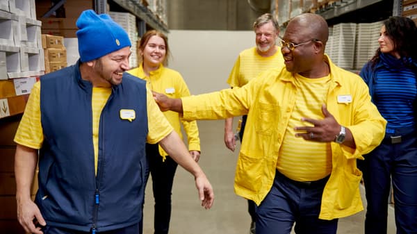 IKEA co-workers smiling to each other and complimenting each other