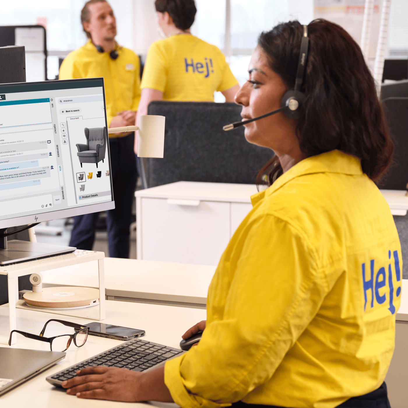 ikea coworker standing infront of computer